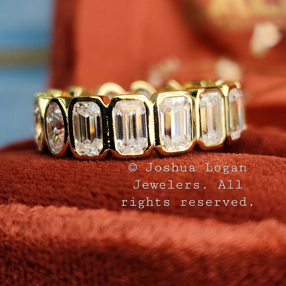 Oval Emerald Moissanite eternity band in 18K yellow gold over sterling silver